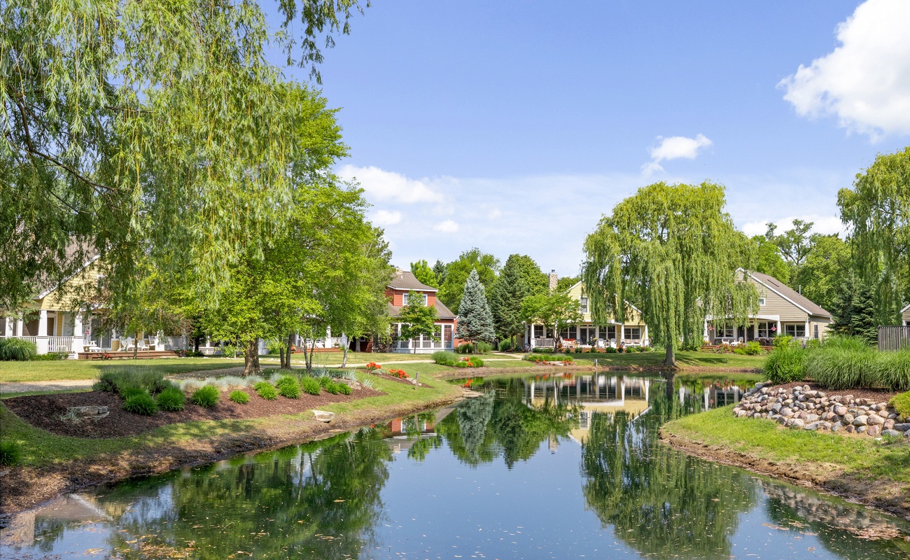 Enjoy the serene pond and beautiful greenery on this tranquil property.