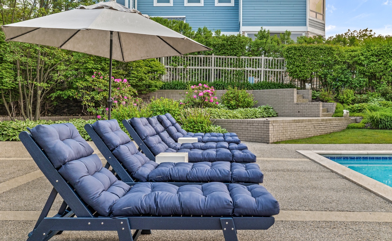 Sleek loungers, lush gardens, and endless summer skies.