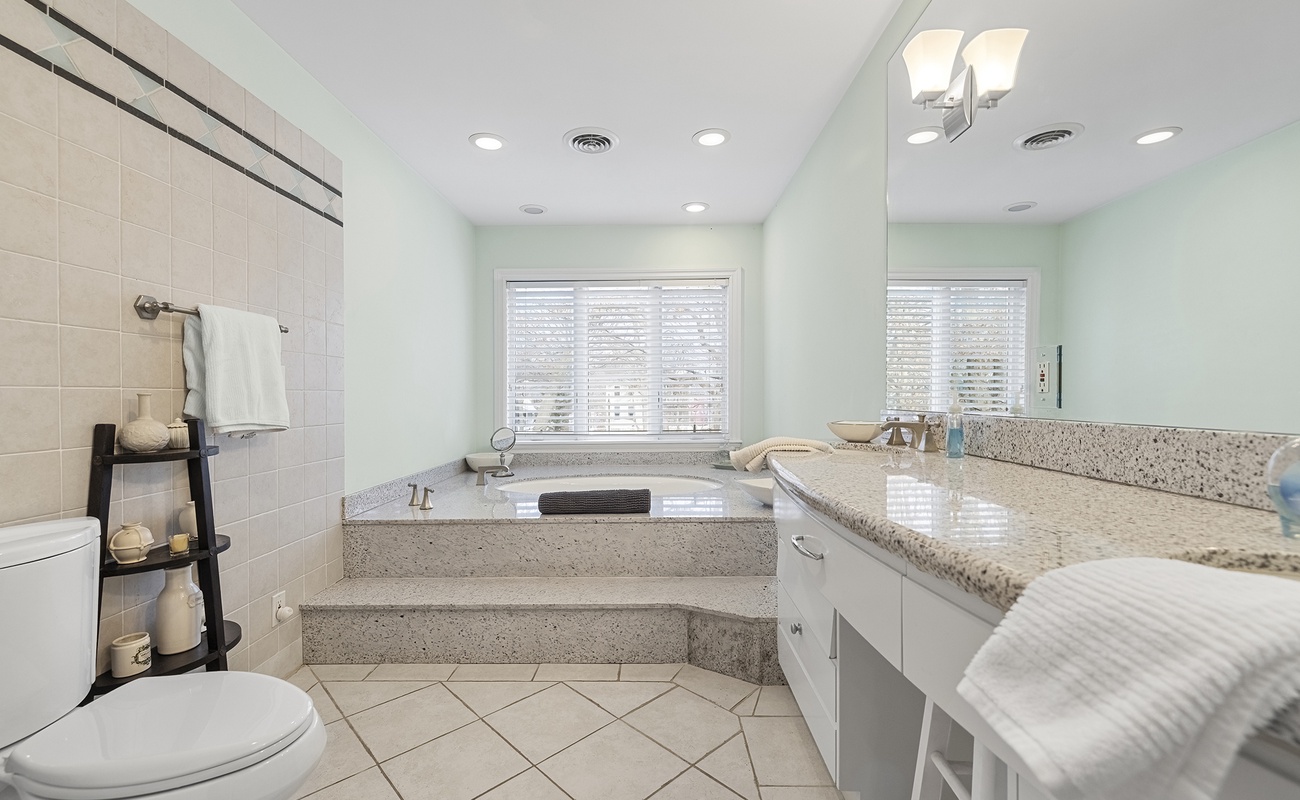 Take your time getting ready in a bright, spa-like bath.