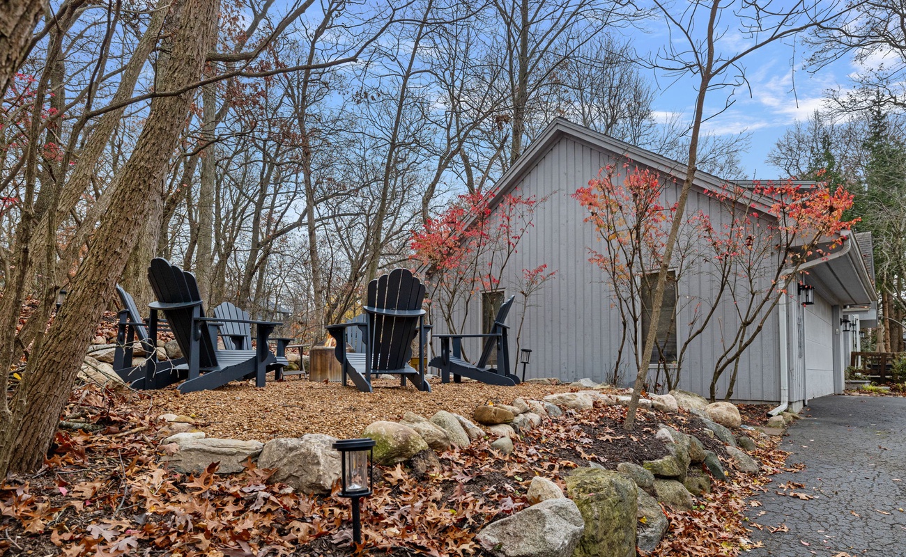 Cozy firepit with woodland views.