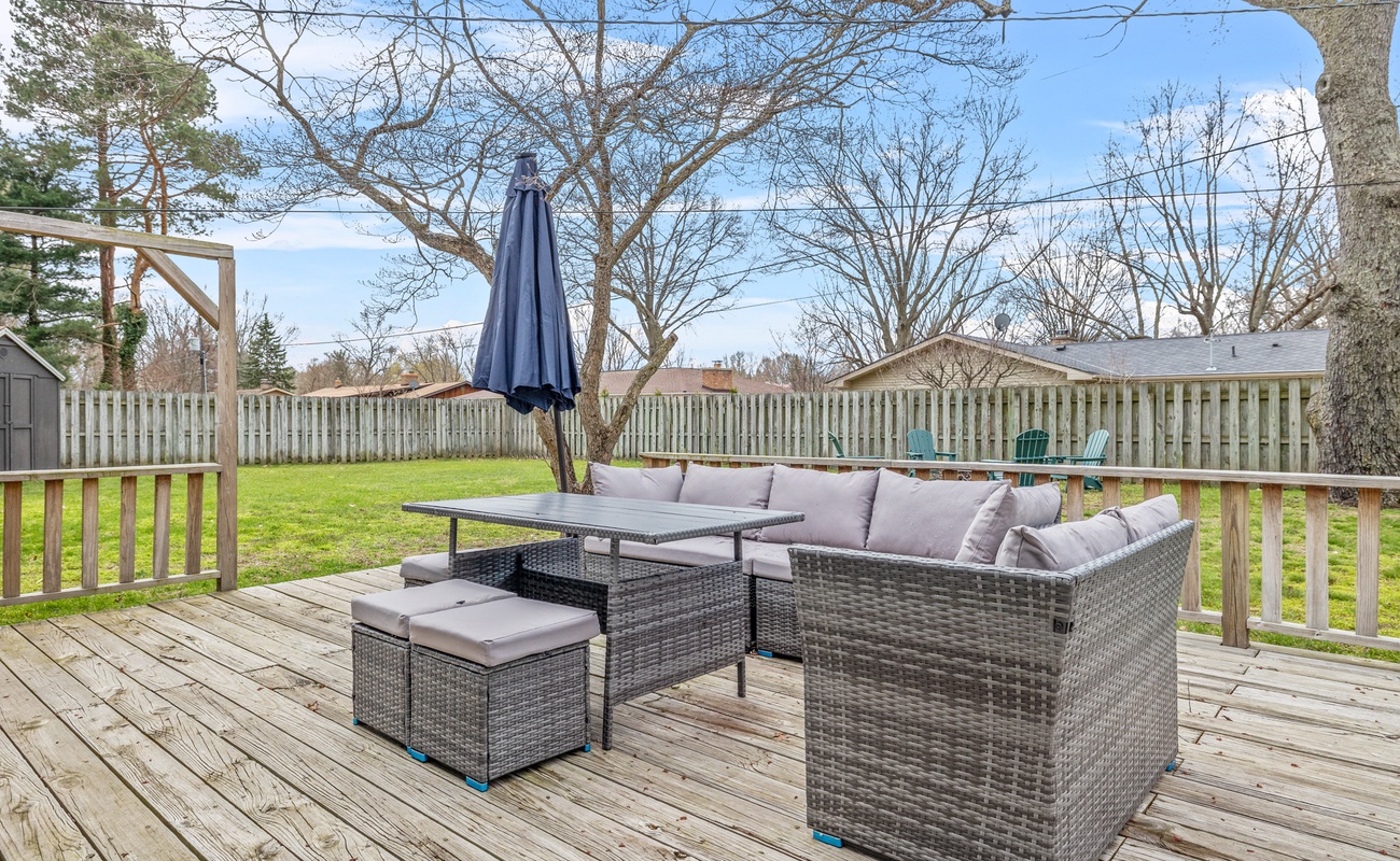 Unwind on our private deck with comfy seating, a spacious yard, and sunny vibes all around.