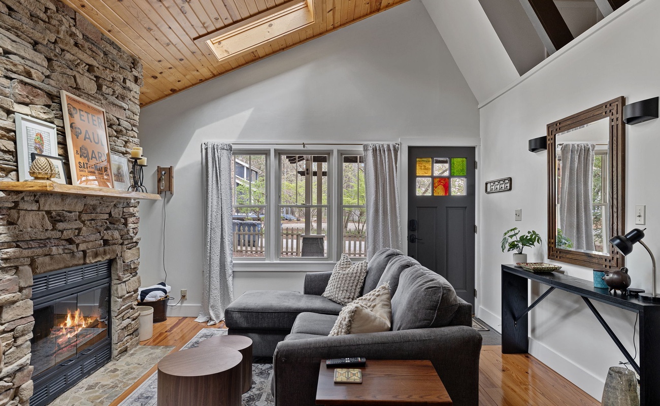 Vaulted ceilings, skylights and a fabulous fireplace. Isn't life grand?