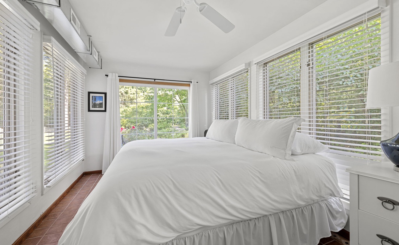 Primary bedroom is on the main level & has a king-size bed.