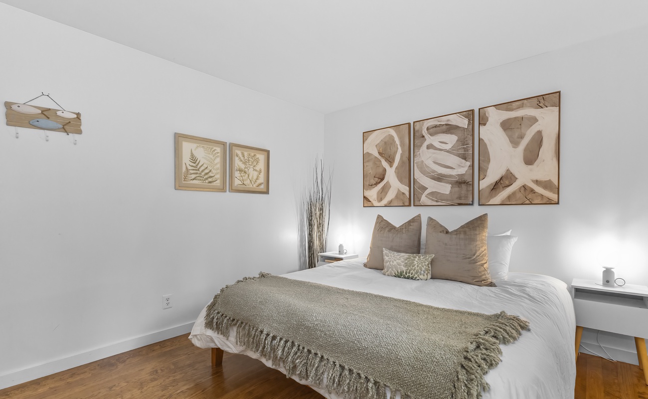 The primary bedroom is on the main level has a king-sized bed.