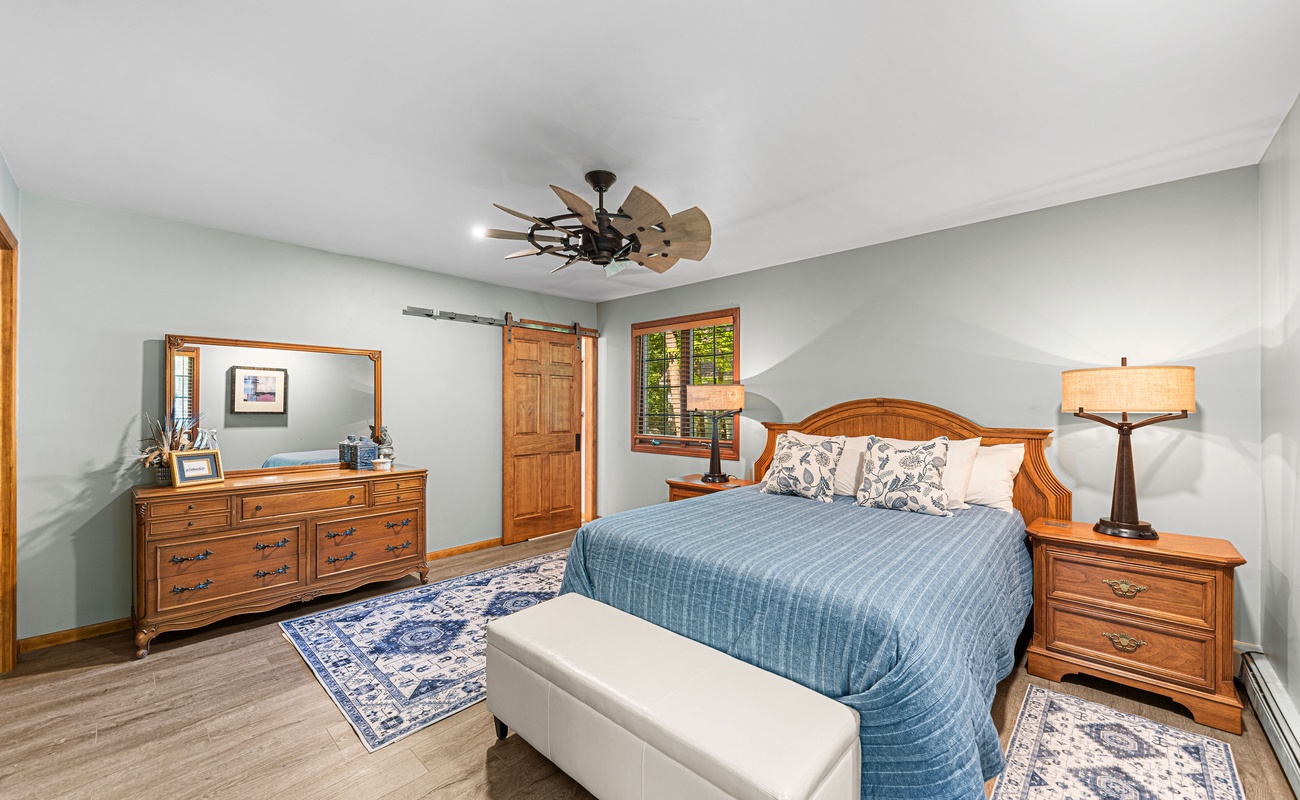 Primary bedroom is on the main level & has a king-size bed.