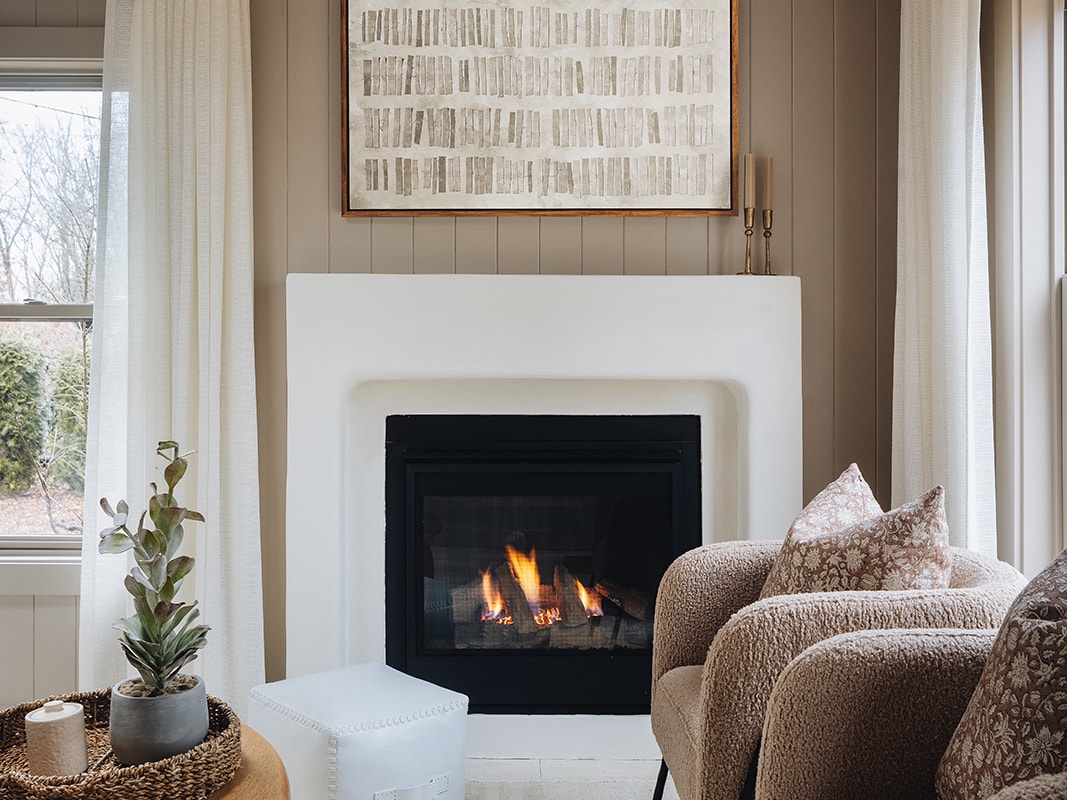 Lots to love about a living room fireplace and a glass of your fave beverage.