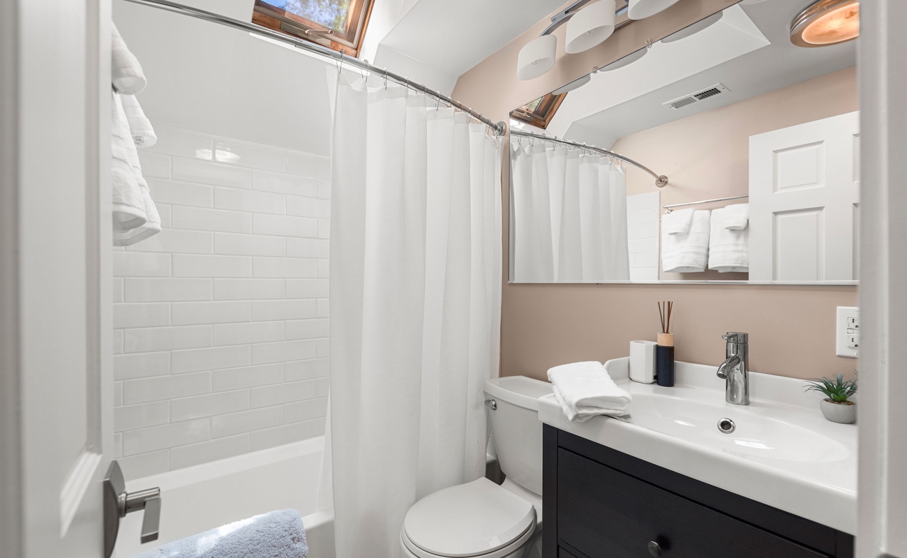 A sunlit soak awaits beneath the skylight.