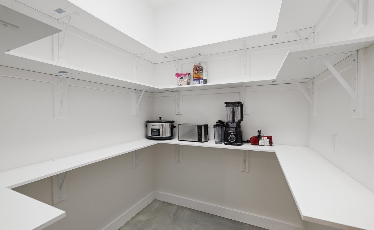Clean and expansive pantry ready for family meals and longer stays.