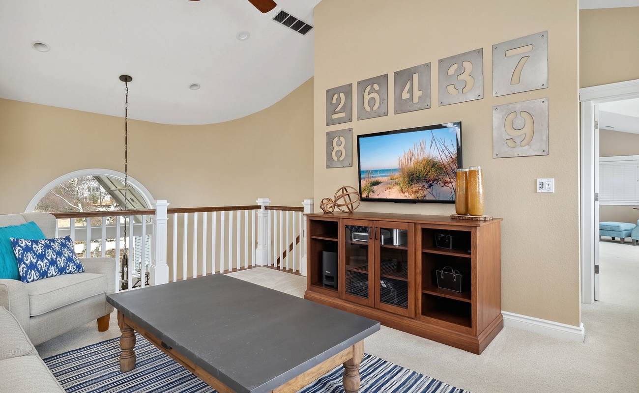 Sink into the plush sofa and enjoy your favorite movie or TV show