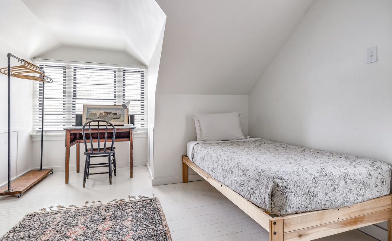 A bed, a desk, and infinite possibilities. Productivity optional, coziness mandatory.