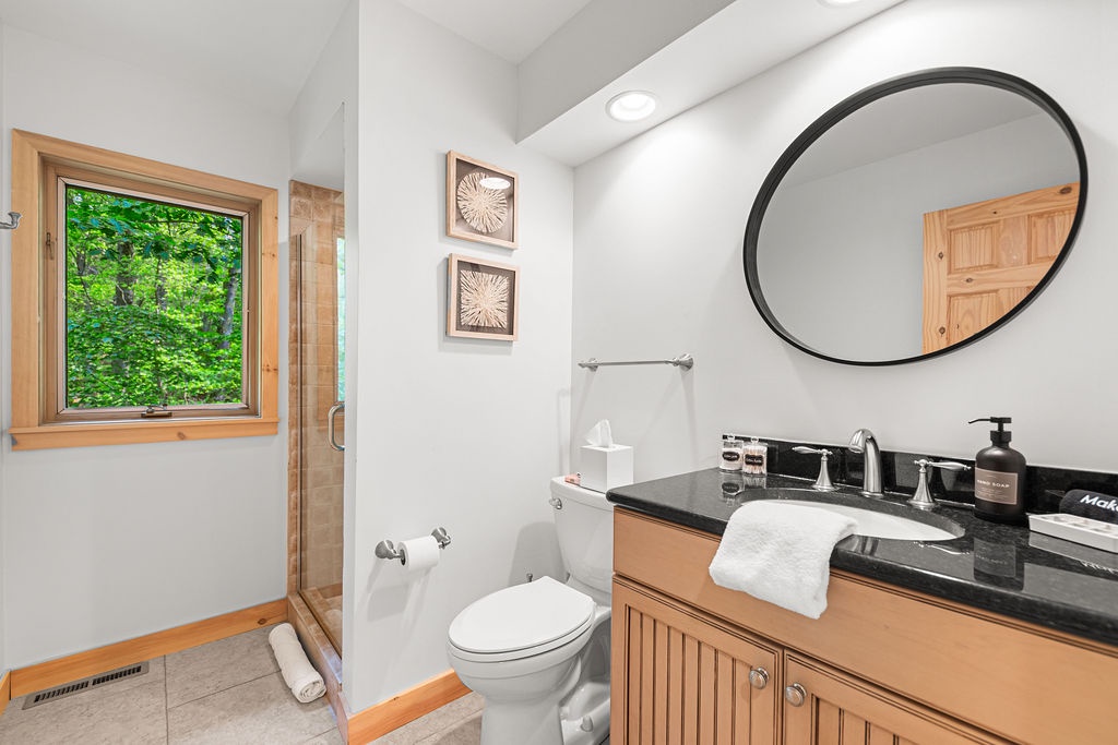 Modern finishes and woodland views—yes, even in here.