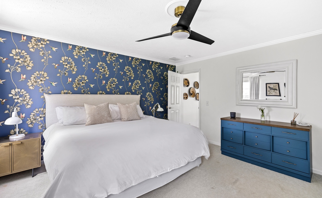 Primary bedroom has a king-size bed.