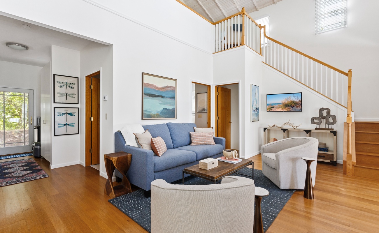 Bright and airy social spaces in this Nantucket-style residence are ideal for family gatherings.