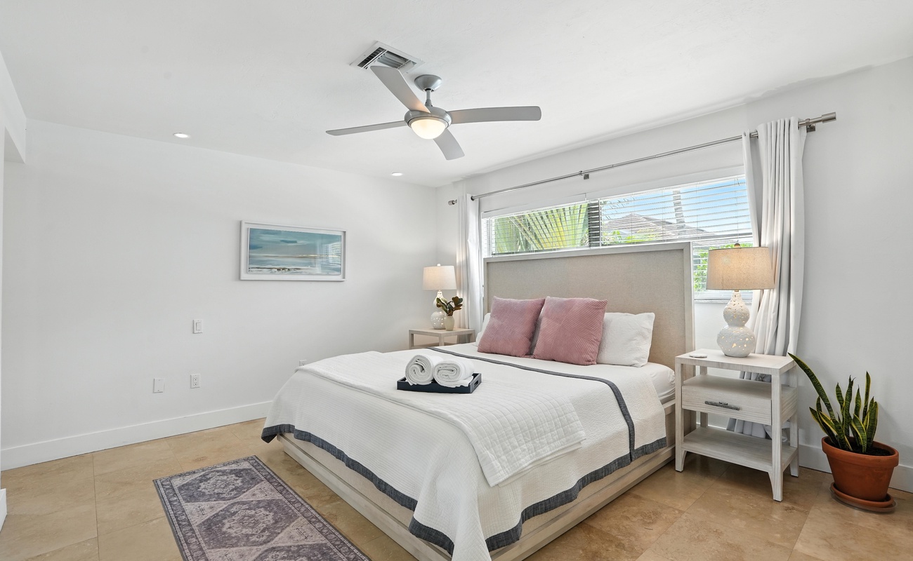 The primary bedroom has a king-size bed.