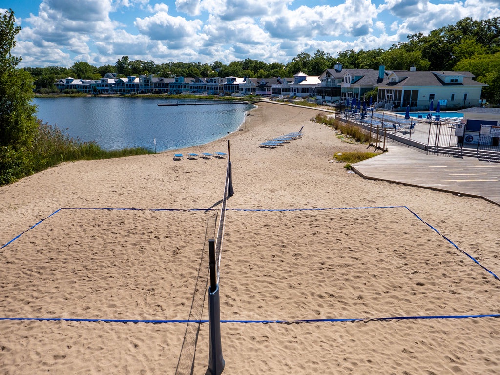 Rally, serve, and play on Beachwalk’s sandy courts.