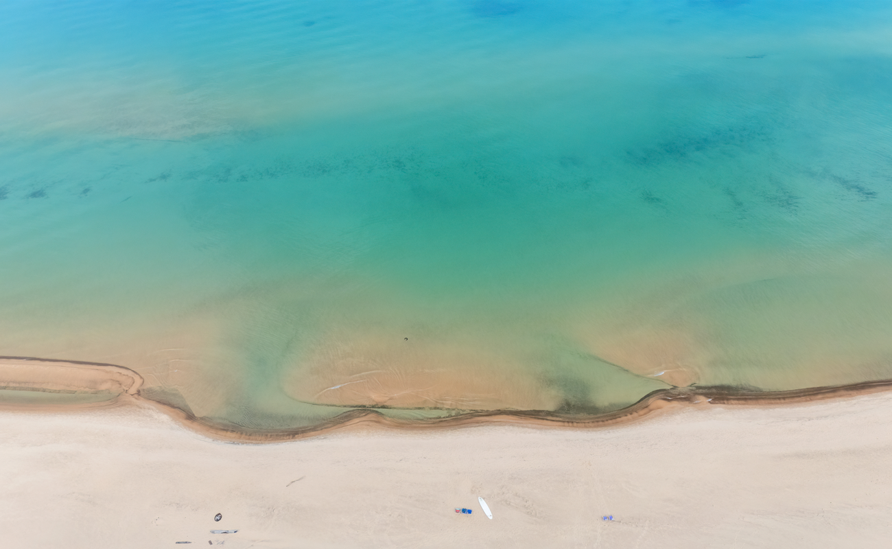 Crystal waters and soft shores, just steps away.