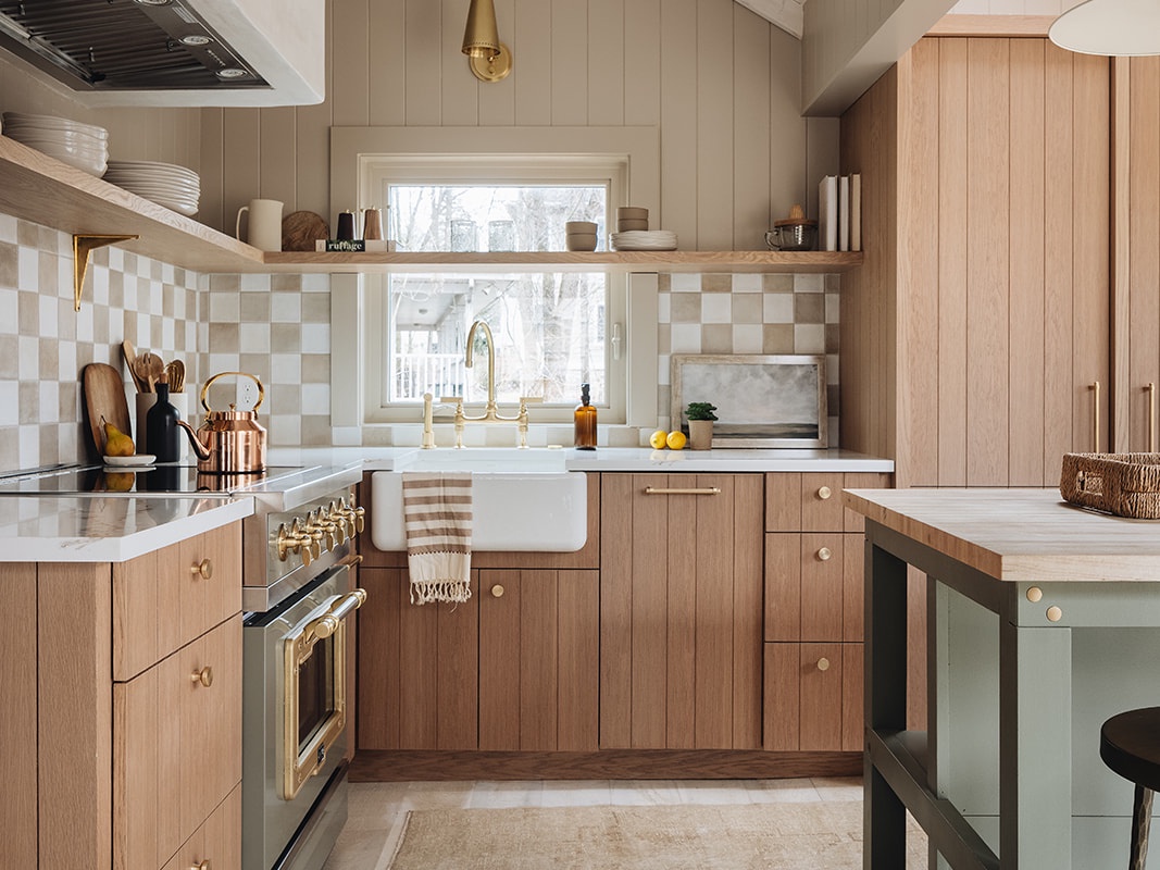 This roomy, smartly designed kitchen motivates the making of scrumptious meals.