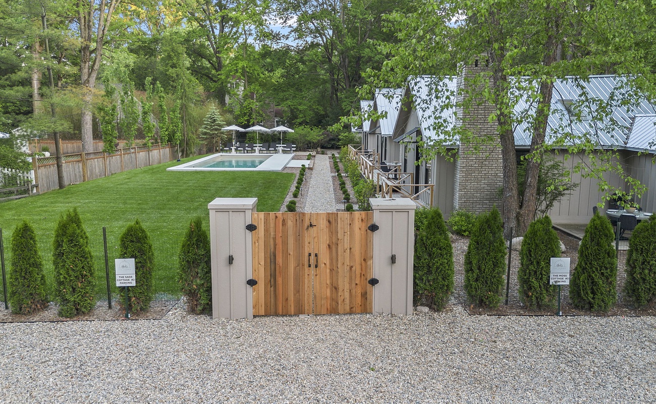 Experience the ultimate in outdoor living with this exquisite house, boasting a sparkling pool and a manicured lawn.