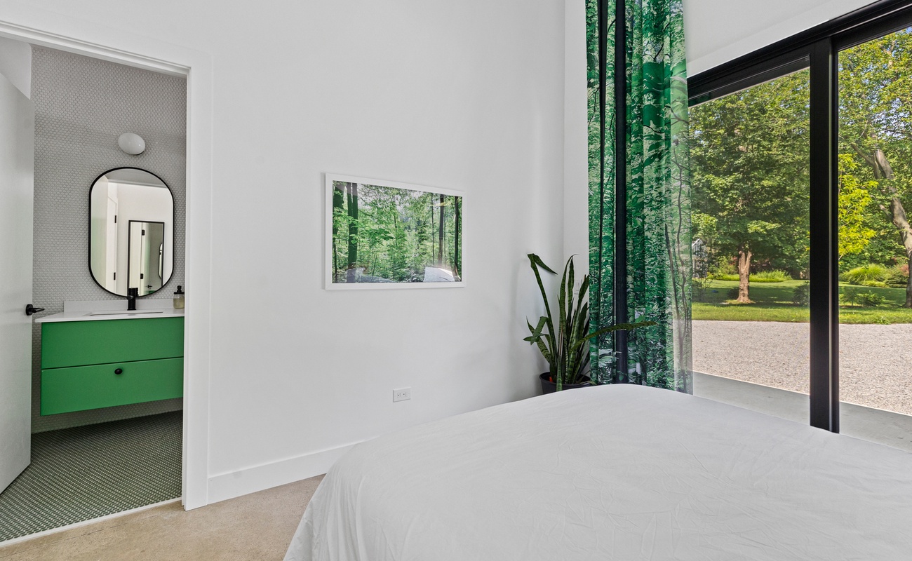 Every bedroom in Owlwood has gorgeous drapes with a photo of Harbert Woods imprinted on them.