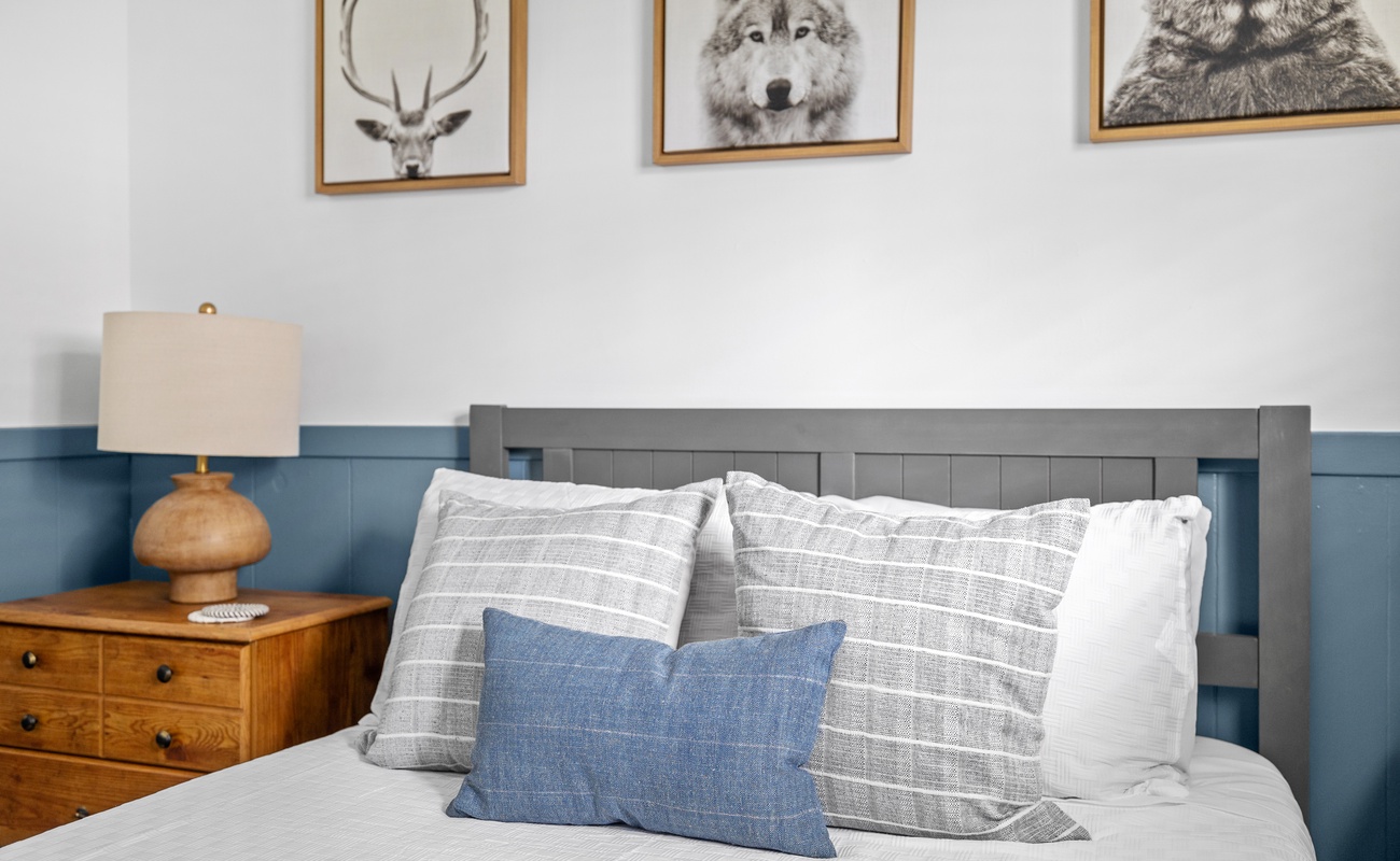 Rustic charm meets refined comfort in this inviting bedroom retreat.