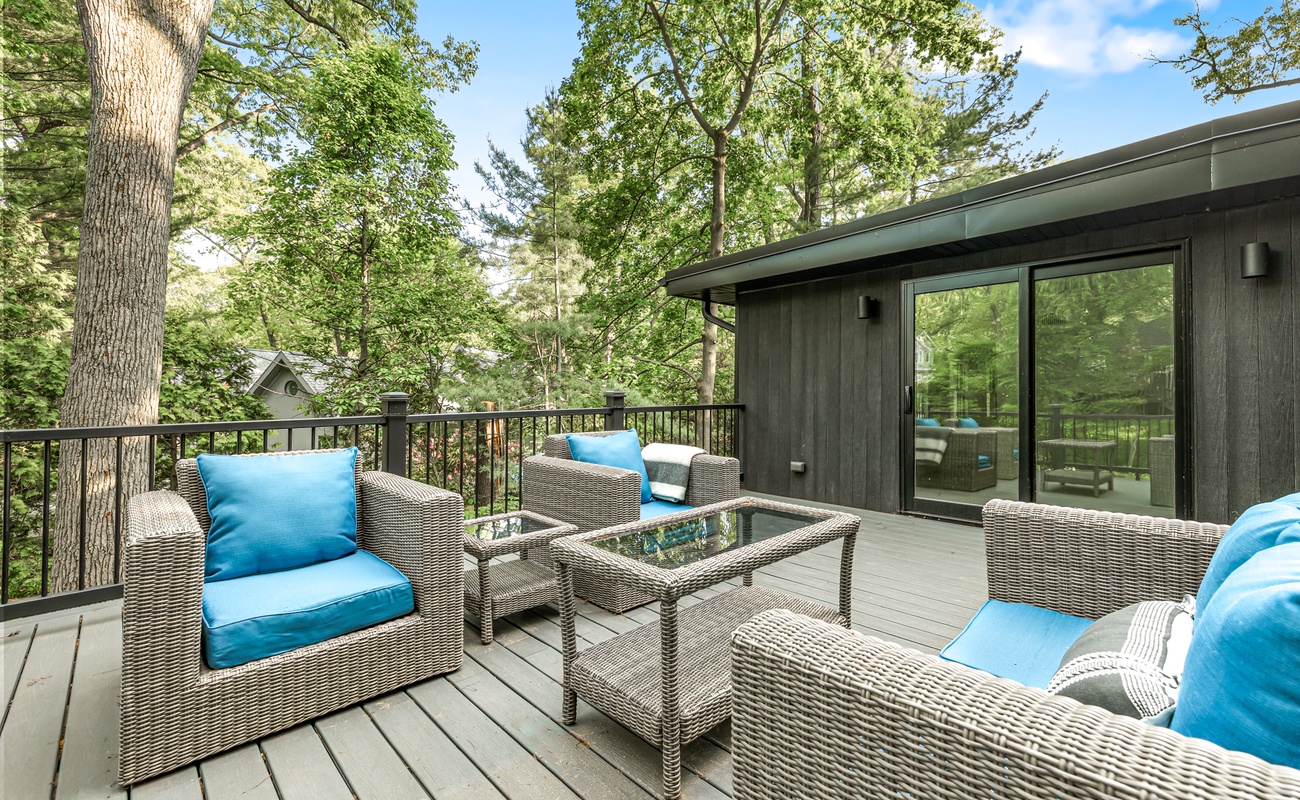 Deck goals: comfy seats + lush views = pure vacation mode.