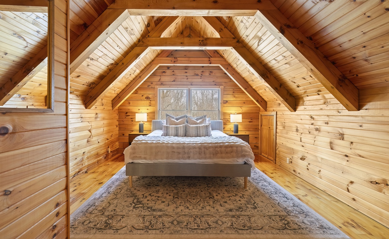 Bedroom 1 is on the upper level with king-sized bed.