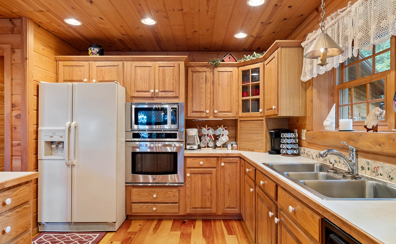 The inviting kitchen is fully equipped to cook delicious meals during your stay.