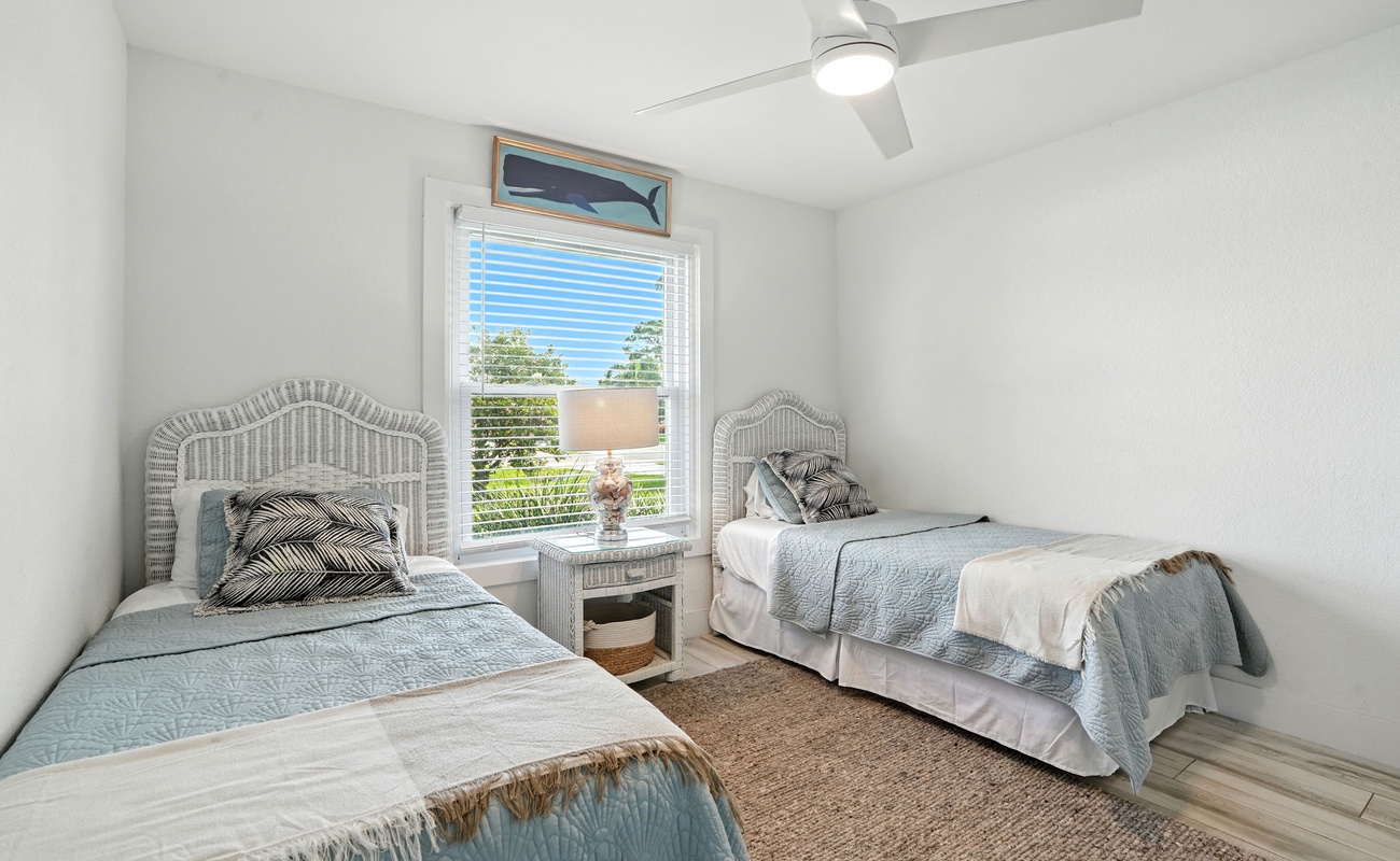 A bright, beachy space with twin beds for easy rest and relaxation.