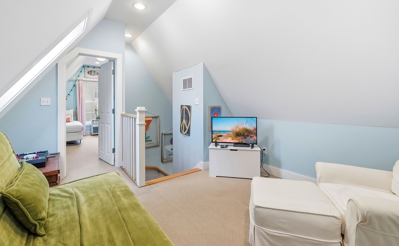 A cozy upper-level hangout made for unwinding together.