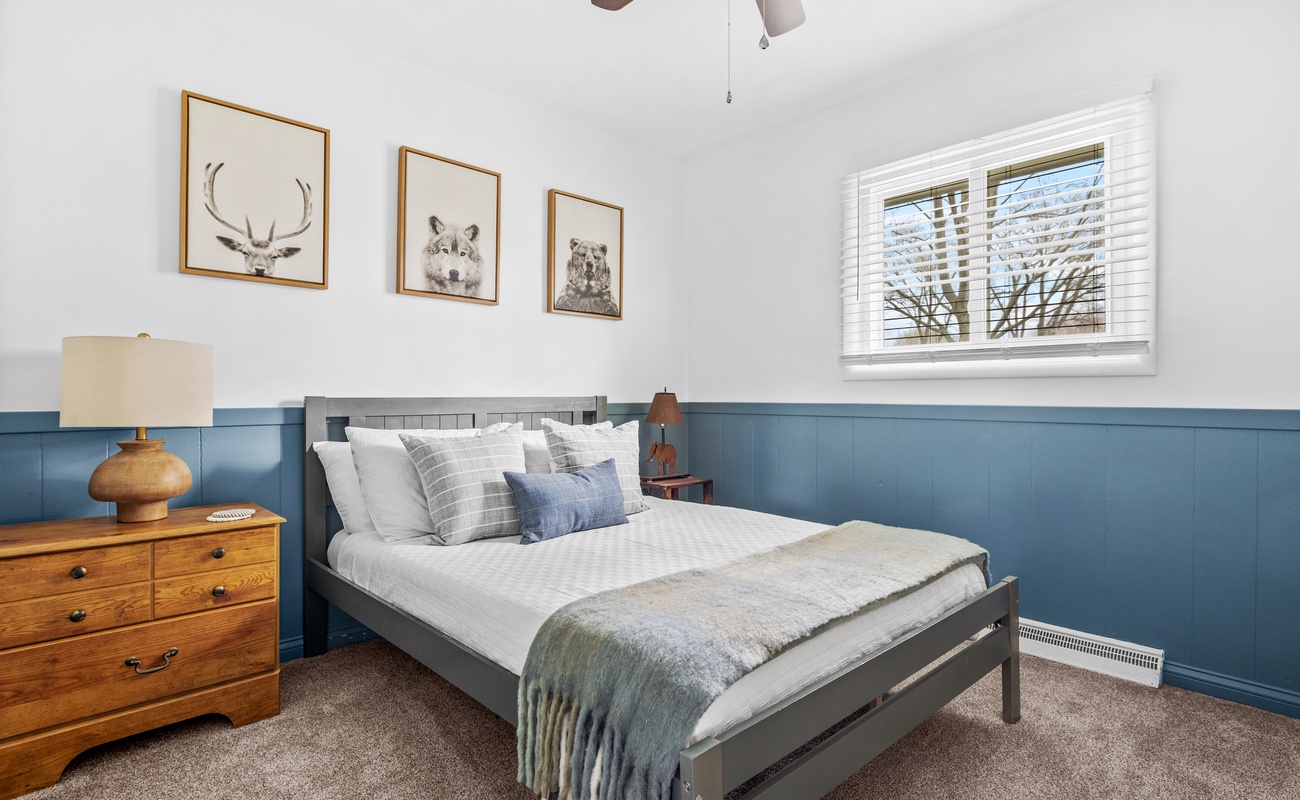 Bedroom 3 is on the main level & has a queen-size bed.