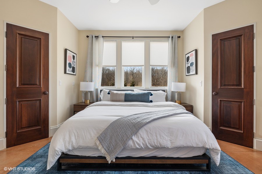 Primary bedroom has a king-size bed.