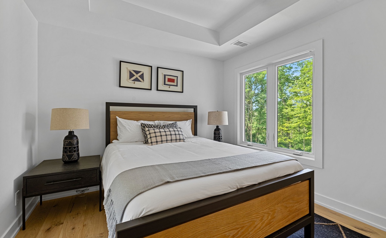 Step into my personal paradise with a cozy bed, nightstand, and window to unwind and recharge.