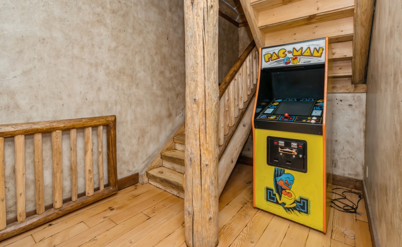 Game on! Pac-Man’s waiting under the stairs.