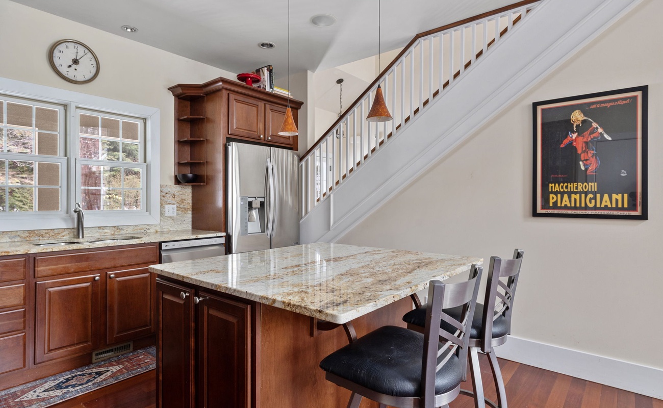 Want a snack or cup of morning coffee? Gather round the kitchen island, y'all!