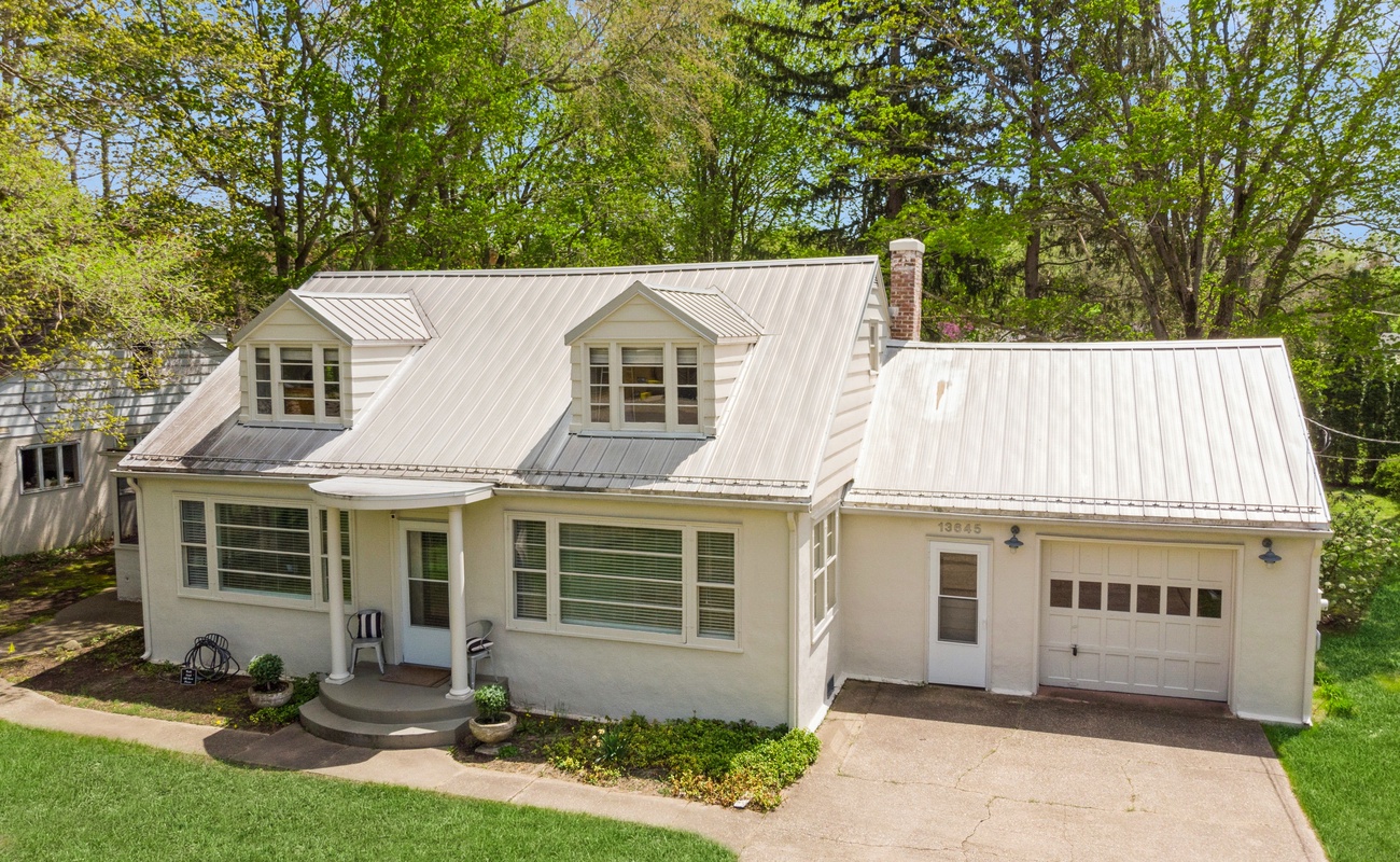 A clean, elegant façade with natural privacy and a welcoming presence.