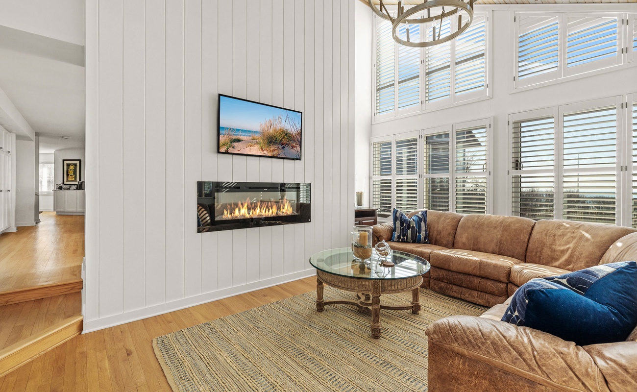 Time for a movie? Wraparound comfort, a fireplace and flat- screen TV. Oh, yeah.