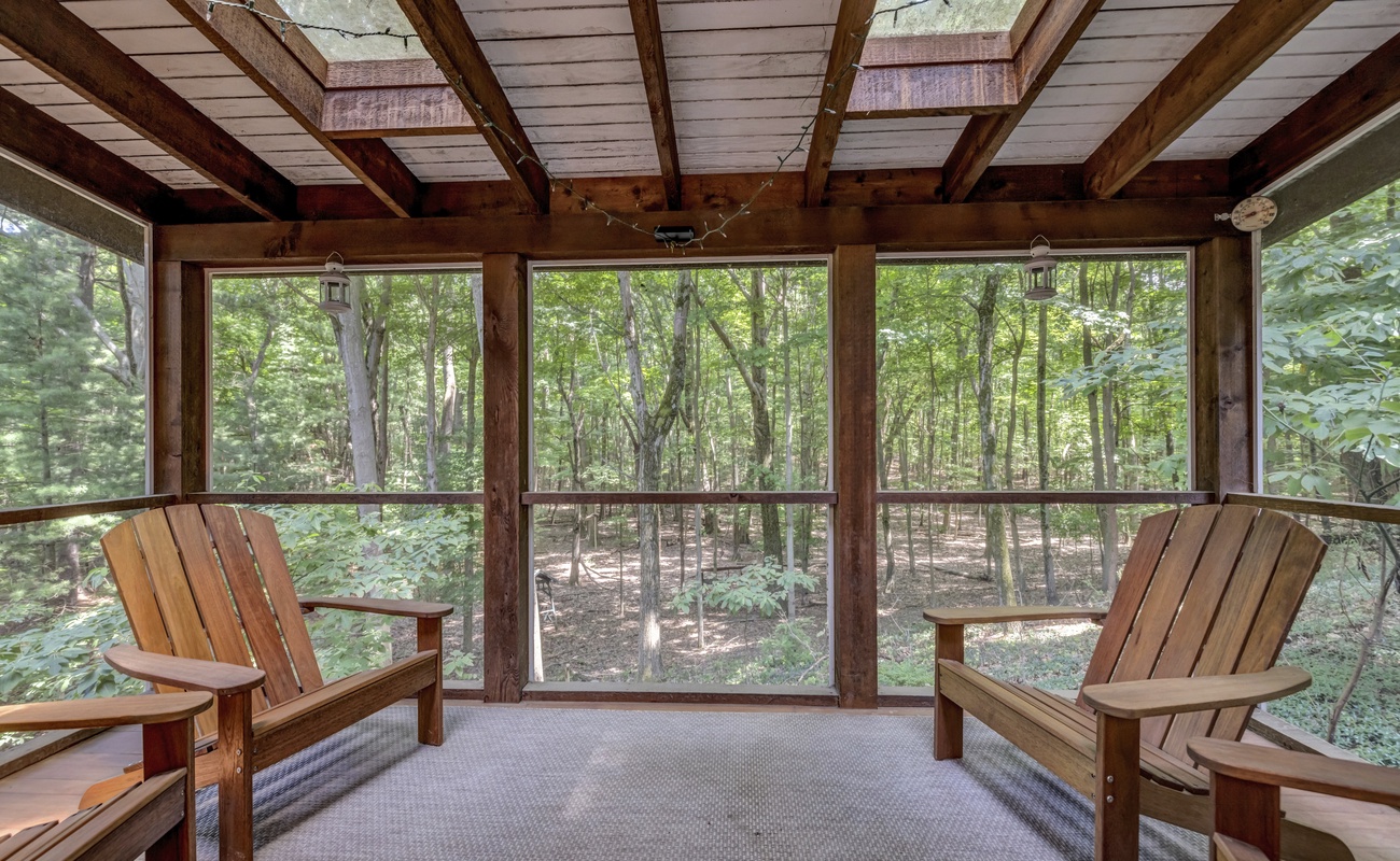 Take in the trees from your private screened-in retreat.
