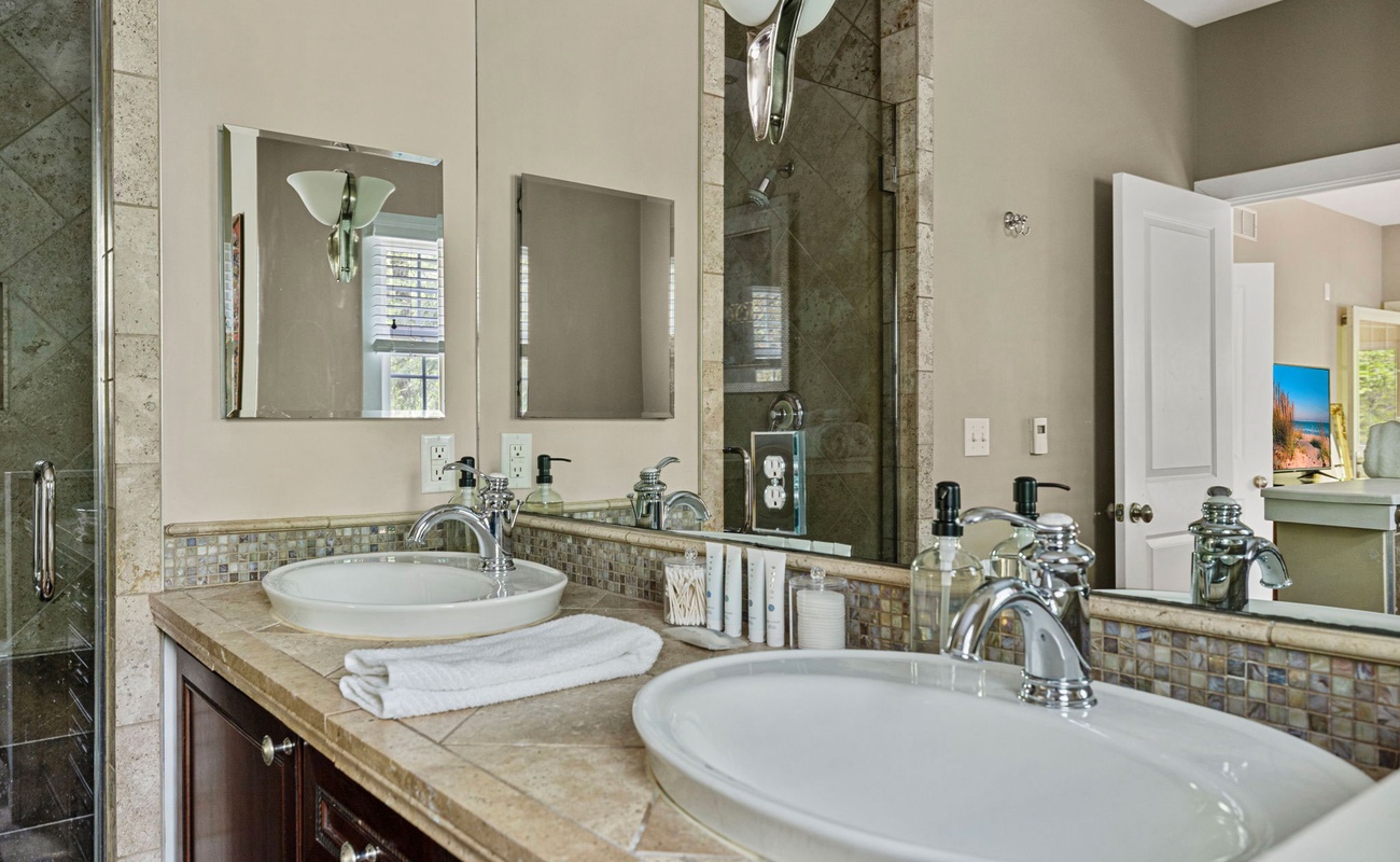 Guests absolutely love the exquisite tiled walk-in shower + dual sink vanities.