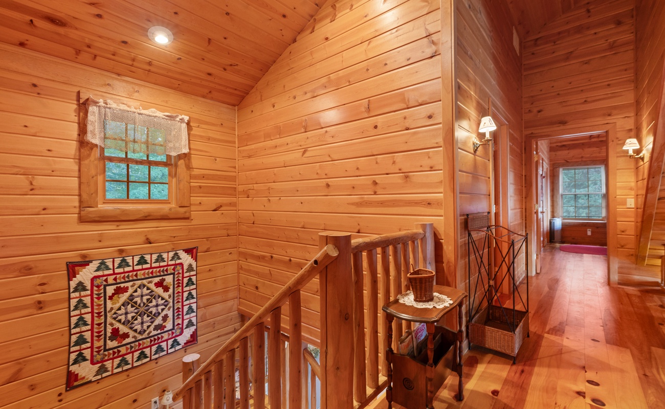 Walking through the upstairs loft you’ll find rustic decor and charming bedrooms.