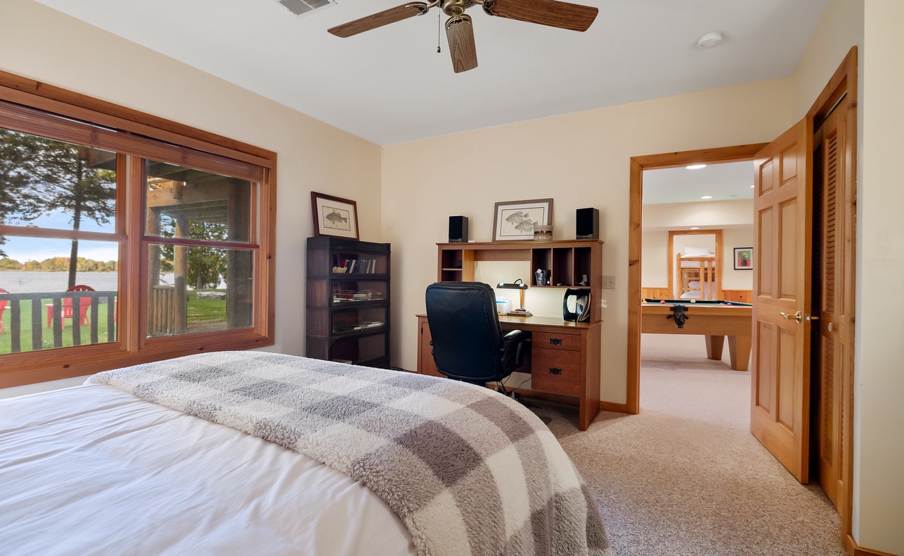 This bedroom is completed with a desk that makes for a perfect blend of comfort and productivity.