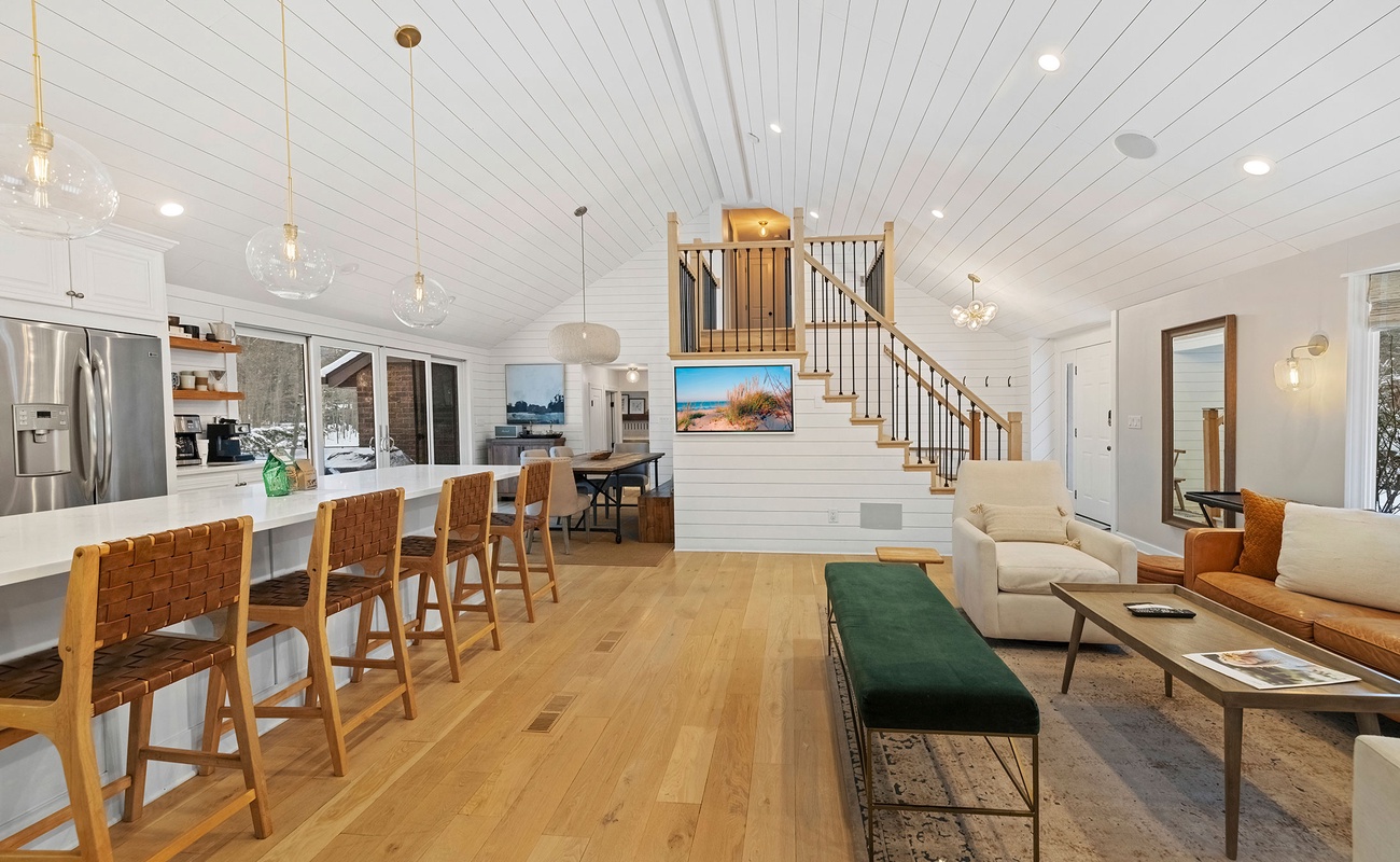 Open sightlines from kitchen to lounges make hosting seamless.