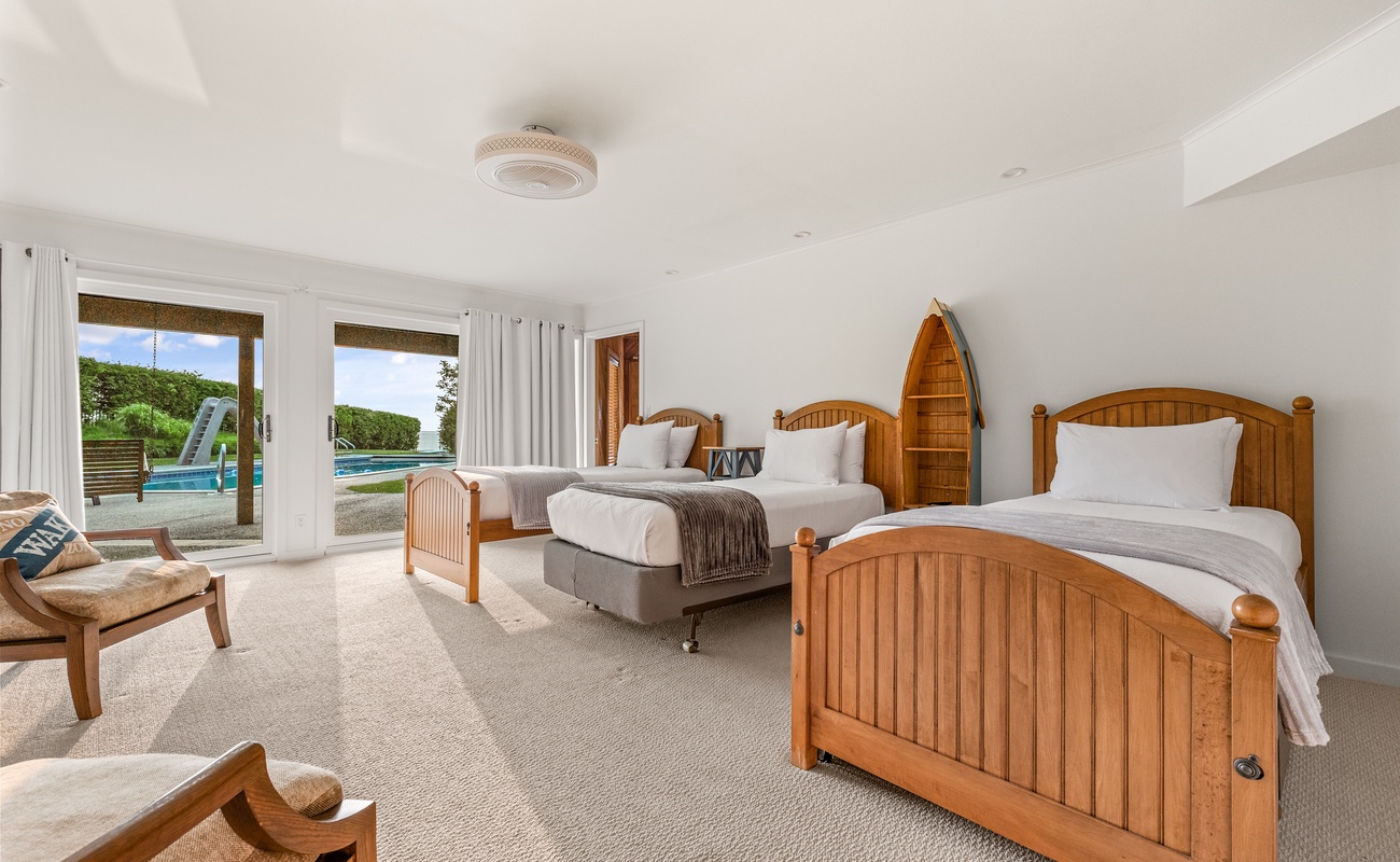 Bedroom 7 is on the lower level & has a 3 twin-sized beds and a trundle bed.