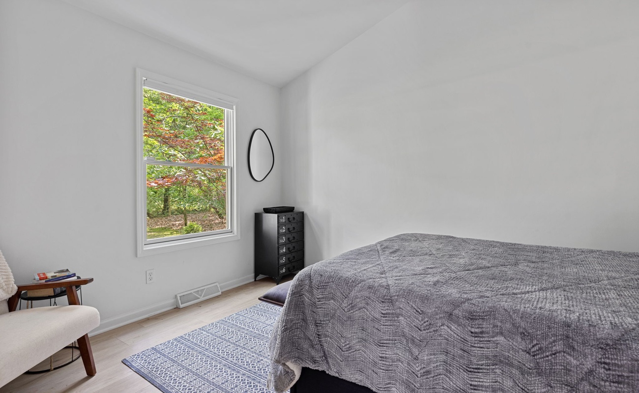 This winsome bedroom has a vaulted ceiling, nice view and a comfy queen bed.