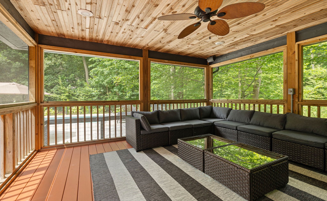 Feel the gentle breeze and listen to the birds while relaxing on this inviting porch.