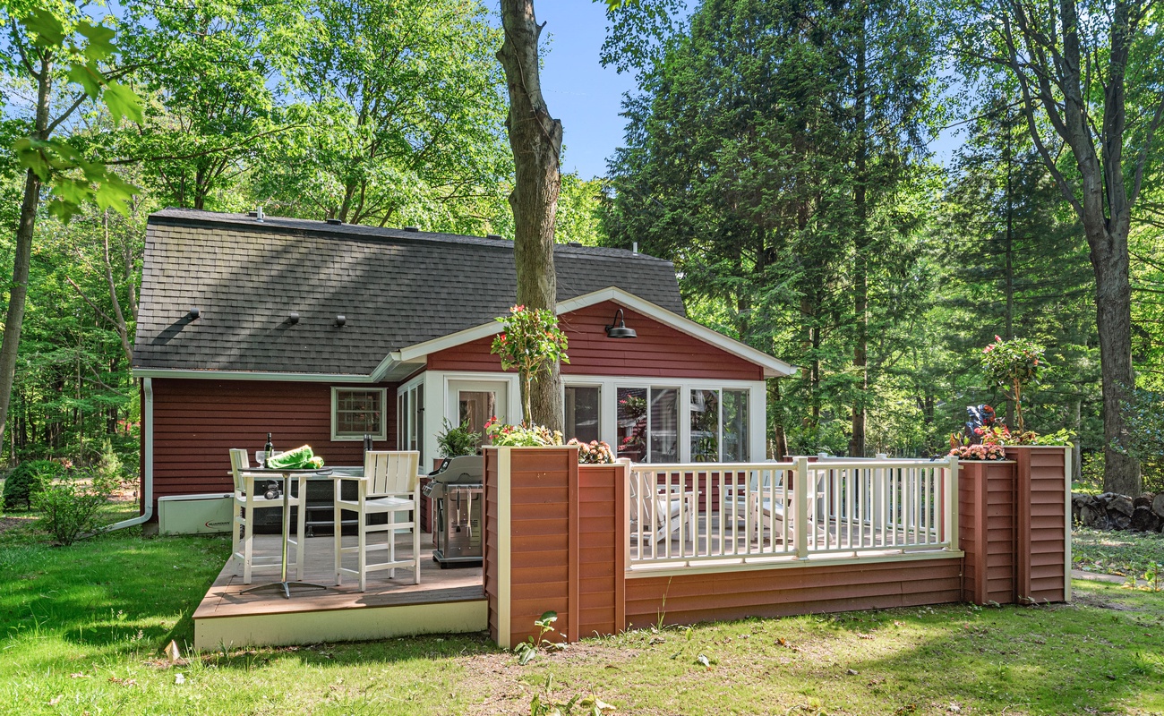 Picture-perfect deck in a peaceful woodland haven.