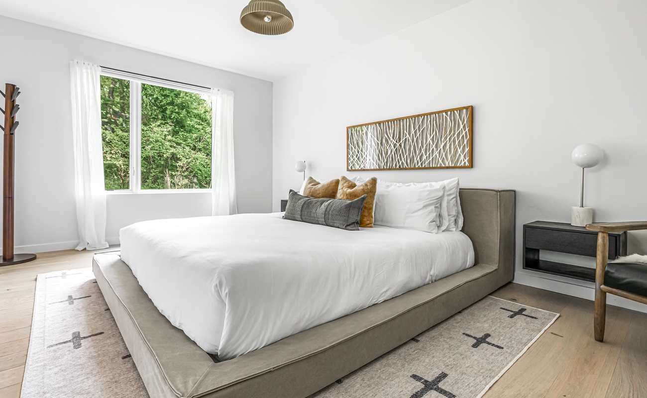 Neutral tones, cozy textures, and a blanket that says, ‘Cuddle up, it’s nap time!’