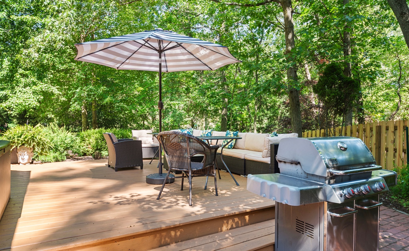 Dine, lounge, and soak up the sun in your private forest deck.