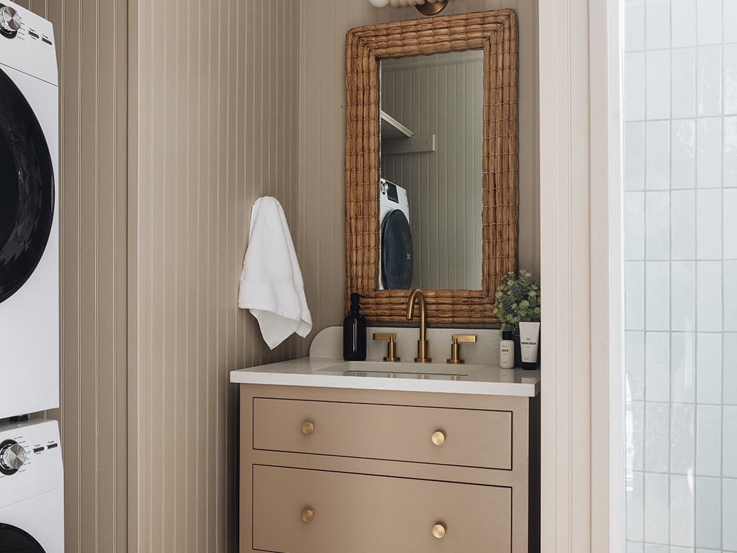This super-chic bathroom also houses a high-end stackable washer-dryer. Boom.