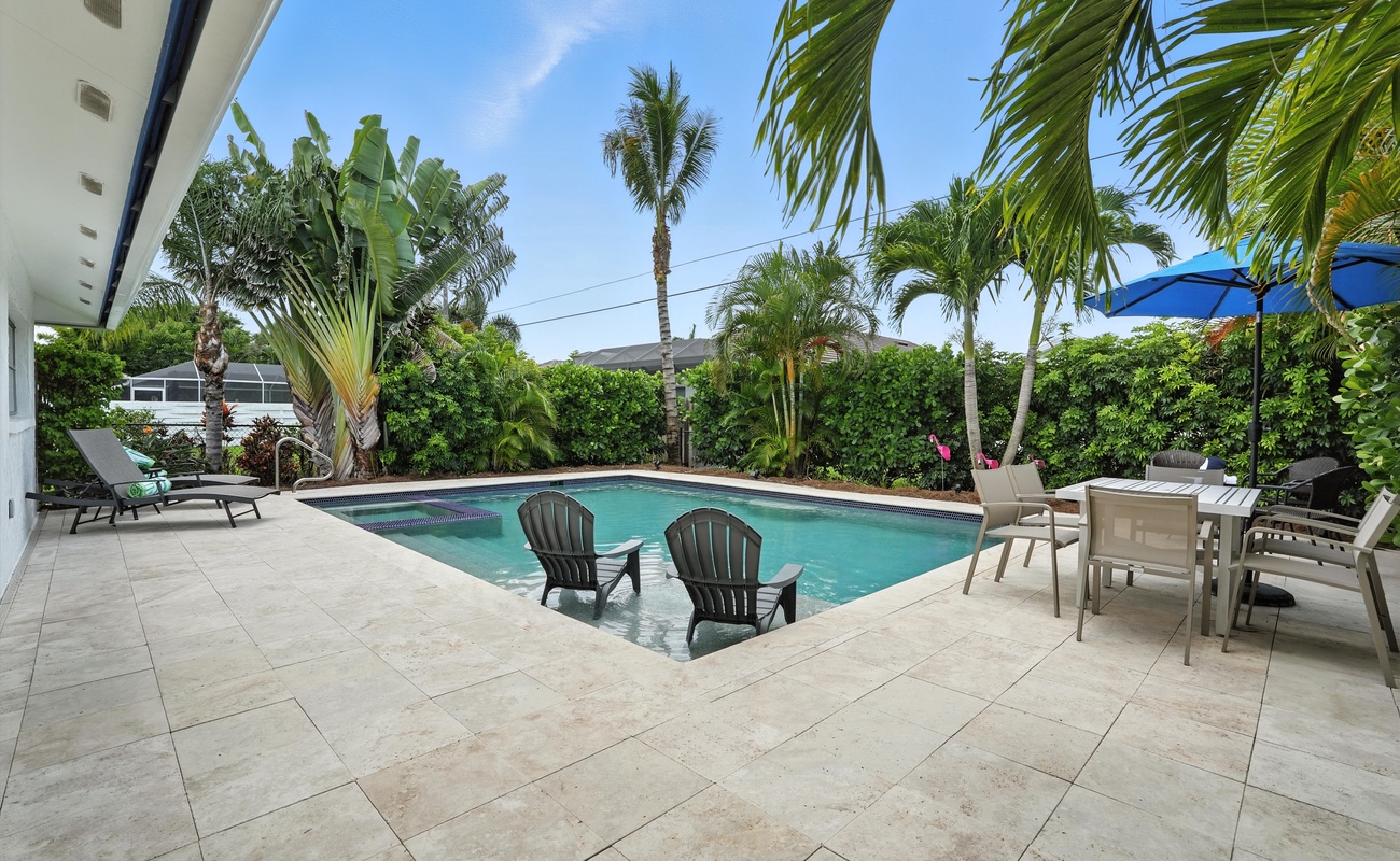 Chill in the water or lounge poolside under the umbrella.