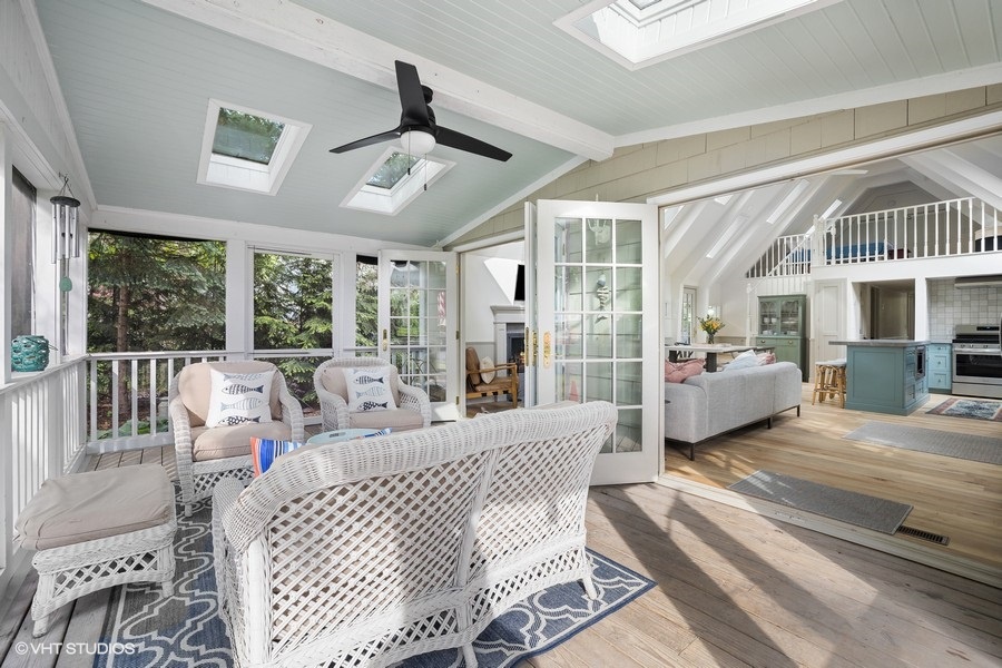 Enjoy the pure delight of indoor/outdoor living by the lake.